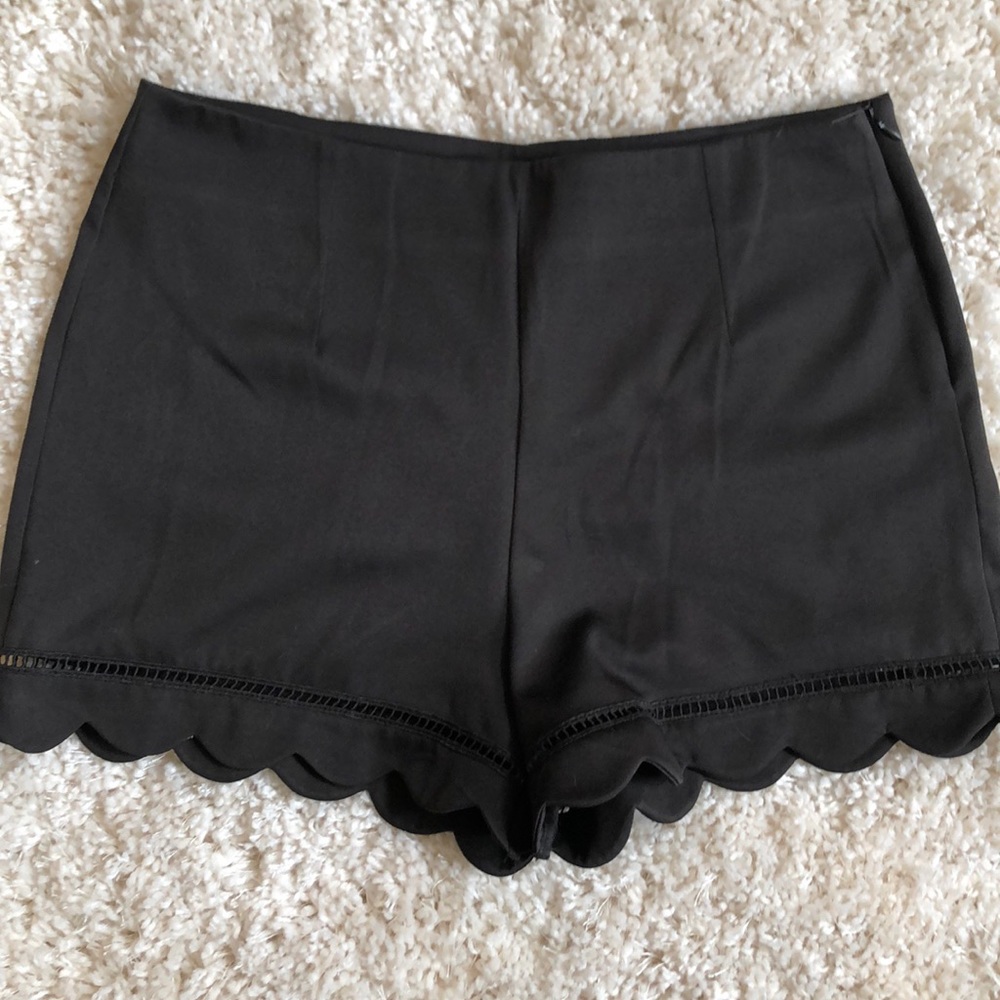 Dressy black scalloped-edge shorts